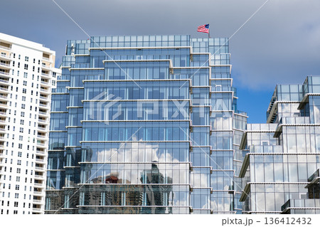 Skyscraper building architecture. Skyscraper with glassy facade. Modern glass building. Skyscraper in business city. City downtown with skyscraper. Office building in business district. Brickell Key 136412432