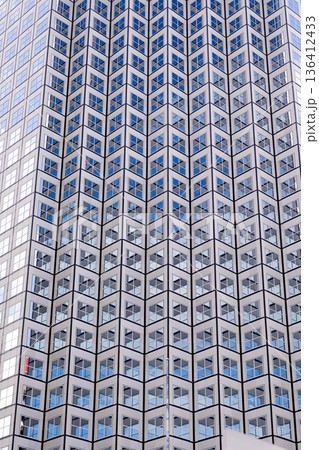 Building facade architecture. Building background. Glass building window. Architectural detail. Background of architecture. Modern glass background. Glass facade background. Architecture 136412433