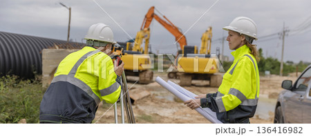 Engineer survey team checking construction project inspection work construction site . Engineer survey team checking construction project inspection work construction site . 136416982