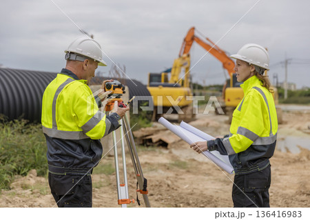 Engineer survey team checking construction project inspection work construction site . Engineer survey team checking construction project inspection work construction site . 136416983