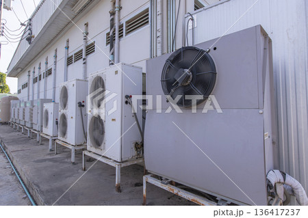 Air conditioner compressor installed in old building. Air conditioner compressor installed in old building. 136417237
