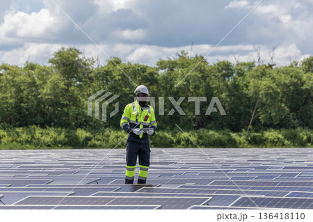 Engineer Checking and working setup Floating solar panels or solar cell Platform system on the lake. Engineer Checking and working setup Floating solar panels or solar cell Platform system on the lake. 136418110