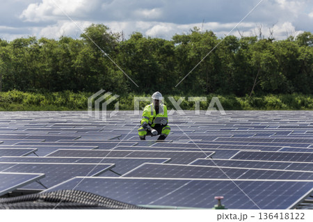 Engineer Checking and working setup Floating solar panels or solar cell Platform system on the lake. Engineer Checking and working setup Floating solar panels or solar cell Platform system on the lake. 136418122
