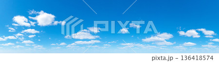 Panoramic fluffy cloud in the blue sky. Sky with cloud on a sunny day. 136418574