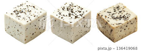 Cubes of seasoned tofu with visible herbs and spices, arranged in stack isolated on white transparent background 136419068