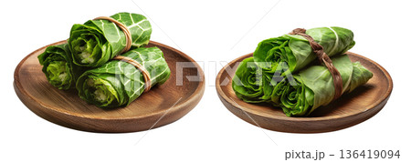 Set of Lu Pulu beef wraps filled with coconut cream in taro leaves on wooden plate, isolated on white transparent background 136419094