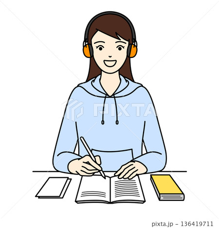 聴覚過敏用のイヤーマフで騒音を遮断し笑顔で勉強を楽しむ若い女性 聴覚過敏用のイヤーマフで騒音を遮断し笑顔で勉強を楽しむ若い女性 136419711
