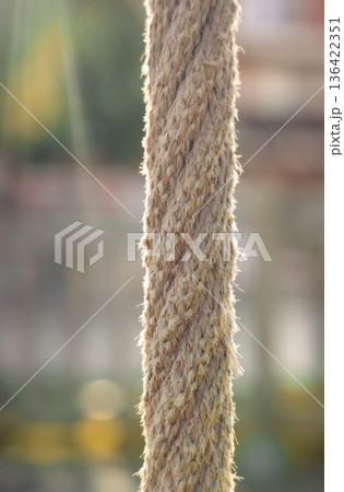 Natural rope texture illuminated by sunlight with soft bokeh background Natural rope texture illuminated by sunlight with soft bokeh background 136422351