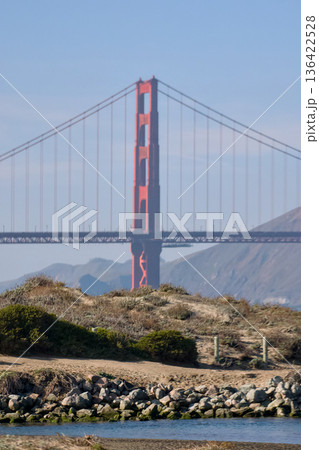 Golden Gate Bridge vertical view from rocky coast 136422528