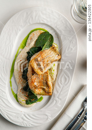 Pan seared white fish with creamy sauce Pan seared white fish with creamy sauce 136422805