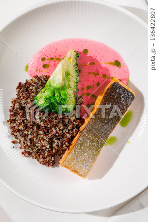 Grilled salmon with quinoa broccoli and sauce Grilled salmon with quinoa broccoli and sauce 136422807