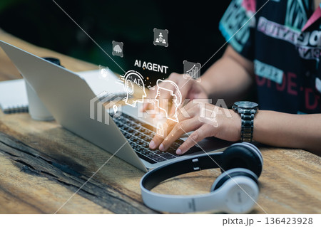 Business man using laptop with AI Agent virtual interface, artificial intelligence assistant for automation, digital transformation, and smart technology solution concept Business man using laptop with AI Agent virtual interface, artificial intelligence assistant for automation, digital transformation, and smart technology solution concept 136423928