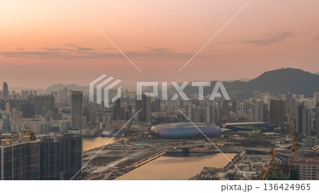 Warm sunset glow illuminates Kai Tak Sports Park Feb 8 2026 136424965