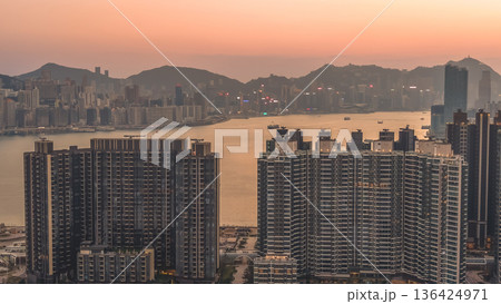 Golden sunset illuminates Kai Tak harbourfront residential skyline Feb 8 2026 136424971