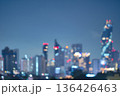 Abstract blurred background cityscape of Krung Thep Maha Nakhon (Bangkok) on night scene with multicolour bokeh from neon light on building  136426463
