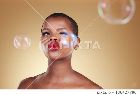 , makeup and bubbles with face of black woman in studio for cosmetics, spa treatment and luxury. Skincare, dermatology and self care with model on gold background for glow, facial and soap mockup , makeup and bubbles with face of black woman in studio for cosmetics, spa treatment and luxury. Skincare, dermatology and self care with model on gold background for glow, facial and soap mockup 136427796