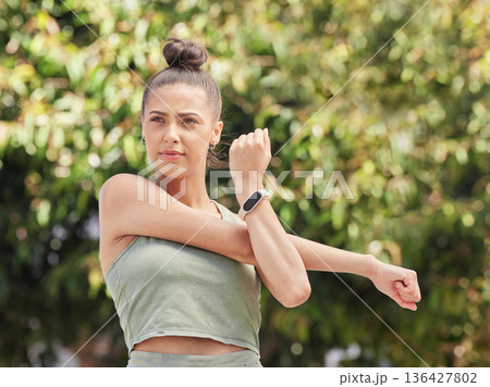 Stretching, thinking and a woman in nature for fitness, running start or getting ready for cardio. Workout, idea and a young runner, athlete or girl with a warm up in a park for training or exercise 136427802