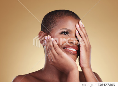 Black woman, hands touching face and beauty with natural cosmetics isolated on studio background. African model, manicure and nail care with smile, makeup and dermatology with skincare and glow 136427803