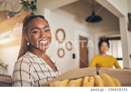 Black woman, portrait and new home with cardboard boxes for moving and property investment. Happy face, smile and couple of friends excited with package for real estate in a living room together Black woman, portrait and new home with cardboard boxes for moving and property investment. Happy face, smile and couple of friends excited with package for real estate in a living room together 136428141