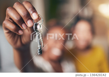 New home, hand and keys with people moving in together for real estate investment. Rent, mortgage and loan as homeowner celebrate at apartment, property or house with partner for freedom or security 136428142