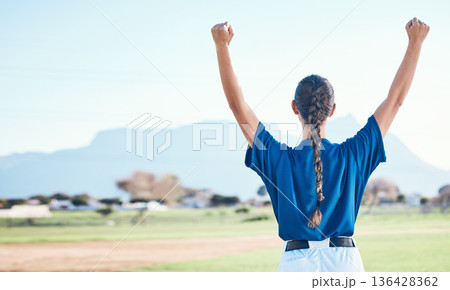 Woman, fist pump and winning, softball and athlete on outdoor pitch, celebration and success with sports. Back view, baseball player and yes, fitness and achievement, cheers and competition winner 136428362