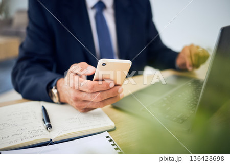 Phone, typing and hand of a business person with internet for research, information technology or contact. Corporate man with smartphone, laptop and notebook for planning, schedule or communication Phone, typing and hand of a business person with internet for research, information technology or contact. Corporate man with smartphone, laptop and notebook for planning, schedule or communication 136428698
