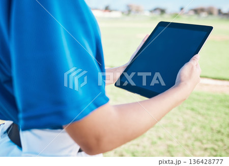 Closeup, baseball or outdoor with a tablet, screen or social media with connection, athlete or fitness. Person, hands or player with technology, online game plan or internet for sports website update Closeup, baseball or outdoor with a tablet, screen or social media with connection, athlete or fitness. Person, hands or player with technology, online game plan or internet for sports website update 136428777