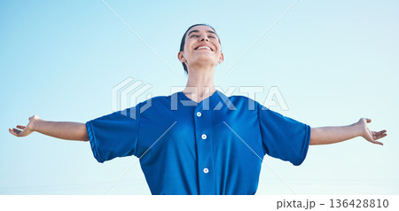Woman, arms out and winning, softball and athlete on outdoor, celebration and success with sports. Blue sky, freedom and happiness, baseball player and fitness with achievement, cheers and winner Woman, arms out and winning, softball and athlete on outdoor, celebration and success with sports. Blue sky, freedom and happiness, baseball player and fitness with achievement, cheers and winner 136428810