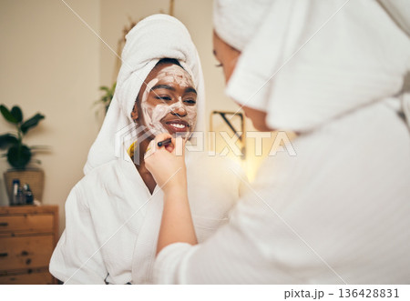 Skincare, facial and women friends in a bedroom with mask, application and spa day bonding in their home. Beauty, cream and people with self care sleepover, lotion or cosmetic wellness on the weekend Skincare, facial and women friends in a bedroom with mask, application and spa day bonding in their home. Beauty, cream and people with self care sleepover, lotion or cosmetic wellness on the weekend 136428831