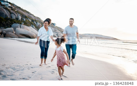 Family, running and happiness on beach, travel with mother, father and kid outdoor, fun together with games and bonding. Travel, adventure and playful, parents and child with happy people and energy Family, running and happiness on beach, travel with mother, father and kid outdoor, fun together with games and bonding. Travel, adventure and playful, parents and child with happy people and energy 136428848