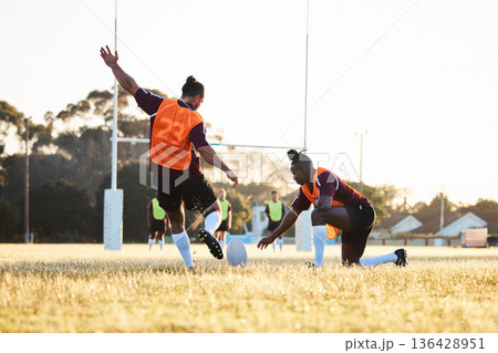 Rugby, kick and sport game with support, exercise and competition with athlete ball training. Field, back and target practice on grass with cardio, fitness and team workout outdoor for teamwork Rugby, kick and sport game with support, exercise and competition with athlete ball training. Field, back and target practice on grass with cardio, fitness and team workout outdoor for teamwork 136428951
