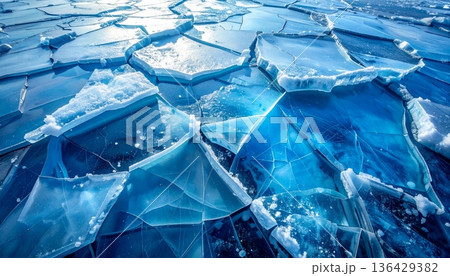 A macro shot of blue ice texture reveals transparent frozen crystals and a clear abstract pattern of frost inside a cold glass cube of water 136429382