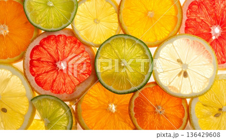A seamless vector pattern of fresh citrus fruit slices featuring juicy lemon, orange, lime, and grapefruit for a healthy ripe food background illustration A seamless vector pattern of fresh citrus fruit slices featuring juicy lemon, orange, lime, and grapefruit for a healthy ripe food background illustration 136429608