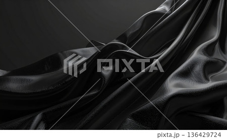 Luxurious black satin fabric features smooth rippled waves and elegant silk drapery to create a soft shiny textile background with a sophisticated velvet texture 136429724