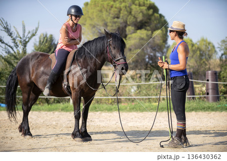 riding girl and horse 136430362
