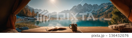 Camping view from tent enjoying lake and mountains. View from inside a tent, enjoying a steaming coffee and book by a clear lake and snowy mountains 136432076