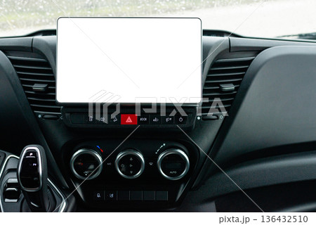 Central car dashboard with blank tablet screen and controls 136432510
