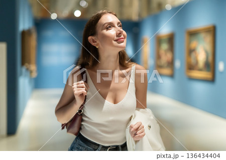 Girl view pictures and icons in museum hall Girl view pictures and icons in museum hall 136434404
