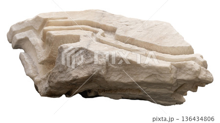 This cut out object shows a rock sculpture with layered lines. It displays the natural shape of stone formed by geological processes. The design highlights the texture of the material 136434806