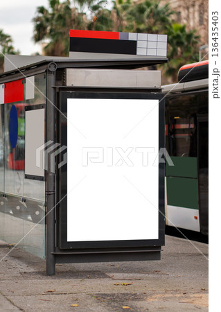 Blank billboard and ad screen at a bus stop providing clear space for digital marketing, outdoor advertising, and promotional mock-ups in a public urban setting Blank billboard and ad screen at a bus stop providing clear space for digital marketing, outdoor advertising, and promotional mock-ups in a public urban setting 136435403