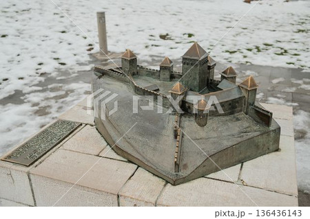 Bronze scale model of Kalemegdan Fortress displayed outdoors in winter, showing historic layout and fortification structure covered by light snow Bronze scale model of Kalemegdan Fortress displayed outdoors in winter, showing historic layout and fortification structure covered by light snow 136436143