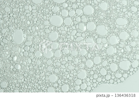 The texture of the foam of shower gel or soap suds. Cosmetic skin care product. Macrophotography 136436318