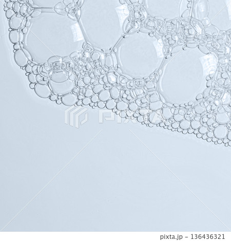 The texture of the foam of shower gel or soap suds or shaving foam. Macrophotography. Copy space The texture of the foam of shower gel or soap suds or shaving foam. Macrophotography. Copy space 136436321