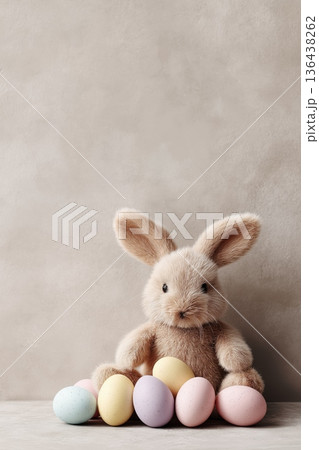 Rabbit sitting beside natural Easter eggs with copy space.  Easter wallpaper. Rabbit sitting next to natural eggs, creating a minimal Easter holiday concept 136438262
