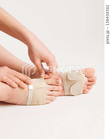 Pads to support the foot on women's legs. Pads to support the foot on women's legs. 136438382