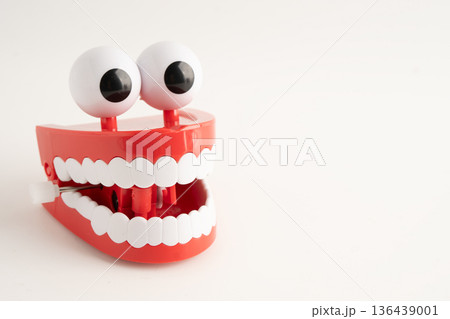 Funny red teeth with eye toy denture model for dental health care. Funny red teeth with eye toy denture model for dental health care. 136439001