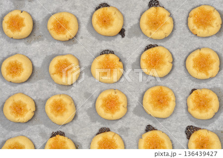 Freshly Baked Homemade Jam Thumbprint Cookies on Baking Paper 136439427