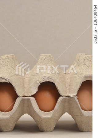 Close up of brown eggs in cardboard carton Close up of brown eggs in cardboard carton 136439464
