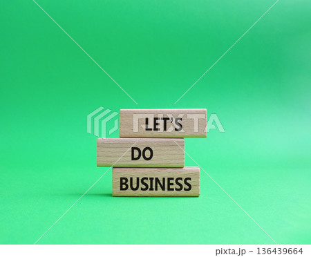 Lets do business symbol. Concept word Lets do business on wooden blocks. Beautiful green background. Business and Lets do business concept. Copy space Lets do business symbol. Concept word Lets do business on wooden blocks. Beautiful green background. Business and Lets do business concept. Copy space 136439664