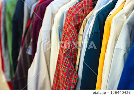 Second hand garment on rail in store Second hand garment on rail in store 136440428